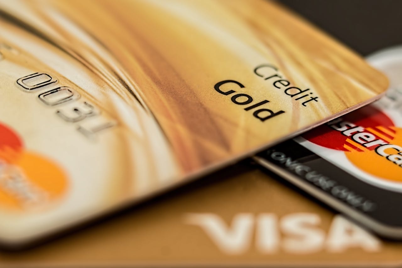 Several credit cards sit on top of each other.