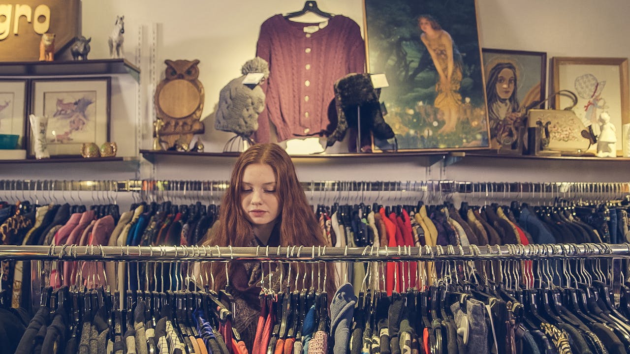 A woman shops in a clothing store.